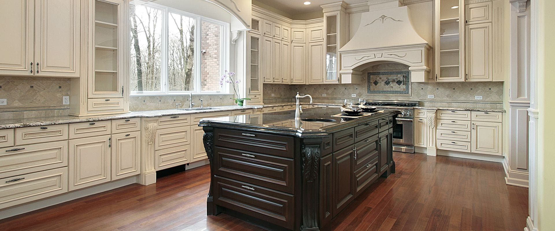 antique white kitchen cabinets with black island